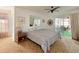 Spacious bedroom with sliding doors leading to a screened porch at 1314 64Th W St, Bradenton, FL 34209