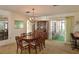 Bright dining room with a wood table and chairs, and view to the outside at 1314 64Th W St, Bradenton, FL 34209