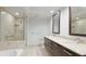 Bathroom with double vanity, soaking tub and walk-in shower at 1350 Main St # 1302, Sarasota, FL 34236