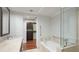 Bathroom with double vanity, soaking tub and walk-in shower at 1350 Main St # 1302, Sarasota, FL 34236