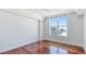 Bright bedroom with hardwood floors and large window at 1350 Main St # 1302, Sarasota, FL 34236