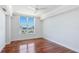 Bedroom with hardwood floors and large window at 1350 Main St # 1302, Sarasota, FL 34236