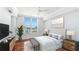 Bright bedroom with hardwood floors and water view at 1350 Main St # 1302, Sarasota, FL 34236