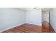 Well-lit bedroom with hardwood floors and access to hallway at 1350 Main St # 1302, Sarasota, FL 34236