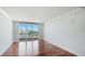 Spacious living room featuring hardwood floors and balcony access at 1350 Main St # 1302, Sarasota, FL 34236