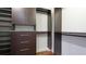 Large walk-in closet with custom shelving and drawers at 1350 Main St # 1302, Sarasota, FL 34236