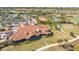 Community clubhouse with tennis courts and a golf course at 13947 Messina Loop, Bradenton, FL 34211