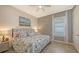 Main bedroom with king-size bed and coastal-inspired decor at 13947 Messina Loop, Bradenton, FL 34211