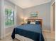 Cozy bedroom with a queen-size bed and calming decor at 13947 Messina Loop, Bradenton, FL 34211