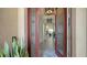 Open entryway with glass door and view into home at 13947 Messina Loop, Bradenton, FL 34211