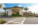 Elegant clubhouse entrance with palm trees at 13947 Messina Loop, Bradenton, FL 34211