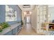 Spacious foyer with gray herringbone accent wall at 13947 Messina Loop, Bradenton, FL 34211