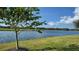 Scenic view of a peaceful lake with lush green landscape at 13947 Messina Loop, Bradenton, FL 34211