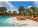 Expansive pool deck with numerous lounge chairs and cabanas at 13947 Messina Loop, Bradenton, FL 34211