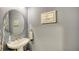 Small powder room with pedestal sink and gray walls at 13947 Messina Loop, Bradenton, FL 34211