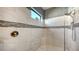 Spacious walk-in shower with marble tile and built-in seat at 13947 Messina Loop, Bradenton, FL 34211