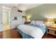 Comfortable bedroom with hardwood floors and ensuite bathroom access at 1423 Landings Pl # 59, Sarasota, FL 34231