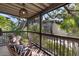 Cozy screened porch with zebra print chairs and lush foliage views at 1423 Landings Pl # 59, Sarasota, FL 34231