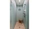 Spa-like shower with light aqua tile and a built-in bench at 1423 Landings Pl # 59, Sarasota, FL 34231