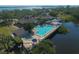 Aerial view of waterfront community pool and homes at 16 Tidy Island Blvd # 16, Bradenton, FL 34210