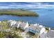 Bird's-eye view of waterfront homes with lush green landscaping at 16 Tidy Island Blvd # 16, Bradenton, FL 34210