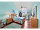 Bright bedroom with vaulted ceiling, hardwood floors, and wood furniture at 16 Tidy Island Blvd # 16, Bradenton, FL 34210