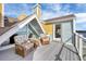 Relaxing deck overlooking the water with wicker chairs and glass-top table at 16 Tidy Island Blvd # 16, Bradenton, FL 34210