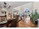 Bright dining room with hardwood floors and a view into the kitchen at 16 Tidy Island Blvd # 16, Bradenton, FL 34210