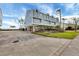 Three-story house with light blue siding and a spacious driveway at 16 Tidy Island Blvd # 16, Bradenton, FL 34210