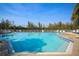 Inviting community pool with plenty of lounge chairs at 16 Tidy Island Blvd # 16, Bradenton, FL 34210