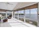 Sunroom with water views and wicker furniture at 16 Tidy Island Blvd # 16, Bradenton, FL 34210