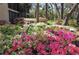 Lush azalea bushes in vibrant pink, white, and purple blooms line the exterior at 1621 Clower Creek Dr # Tr173, Sarasota, FL 34231