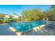 Inviting swimming pool with lounge chairs and umbrellas at 1621 Clower Creek Dr # Tr173, Sarasota, FL 34231