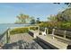 Relaxing waterfront deck with wooden benches at 1621 Clower Creek Dr # Tr173, Sarasota, FL 34231