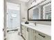 Contemporary bathroom with geometric wallpaper and a large vanity at 1718 Prospect St, Sarasota, FL 34239