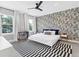 Modern bedroom with a graphic-novel accent wall and a comfy bed at 1718 Prospect St, Sarasota, FL 34239