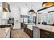 Gourmet kitchen with white cabinets, granite countertops, and a farmhouse sink at 1718 Prospect St, Sarasota, FL 34239