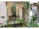 Relaxing porch with wicker chairs and tropical plants at 1718 Prospect St, Sarasota, FL 34239