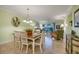 Dining room with wood table and white chairs at 1801 Gulf N Dr # 175, Bradenton Beach, FL 34217