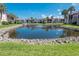 Landscaped pond with fountain in community at 1801 Gulf N Dr # 175, Bradenton Beach, FL 34217