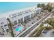 Aerial view showing beach access and oceanfront location at 19610 Gulf Blvd # 303, Indian Shores, FL 33785