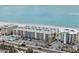 Aerial view of beachfront condo building and parking area at 19610 Gulf Blvd # 303, Indian Shores, FL 33785