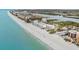 Wide aerial view of beachfront property and coastline at 19610 Gulf Blvd # 303, Indian Shores, FL 33785