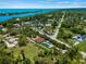 Aerial view of waterfront property showcasing house and pool at 1981 Bayshore Dr, Englewood, FL 34223