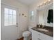 Clean bathroom with granite vanity and tiled floor at 1981 Bayshore Dr, Englewood, FL 34223