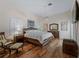 Main bedroom with hardwood floors and ceiling fan at 1981 Bayshore Dr, Englewood, FL 34223