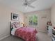 Charming bedroom with twin bed, shelving and window seat at 1981 Bayshore Dr, Englewood, FL 34223