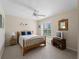 Bright bedroom featuring a wooden bed frame and window seat at 1981 Bayshore Dr, Englewood, FL 34223