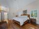 Main bedroom with hardwood floors and a ceiling fan at 1981 Bayshore Dr, Englewood, FL 34223