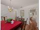 Spacious dining room featuring hardwood floors and view into living room at 1981 Bayshore Dr, Englewood, FL 34223